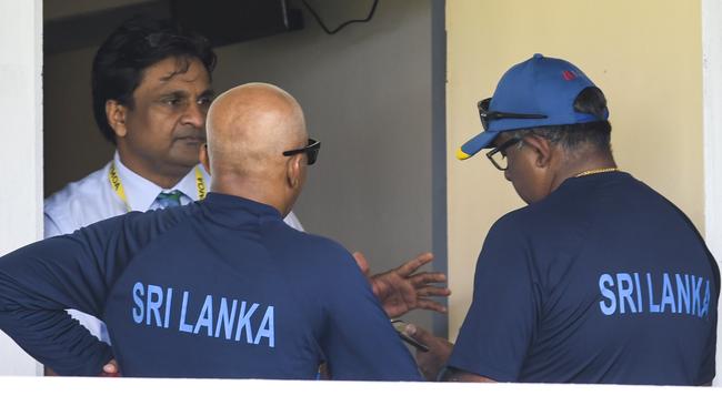 Match referee Javagal Srinath tries to end the stand-off. Picture: AFP.