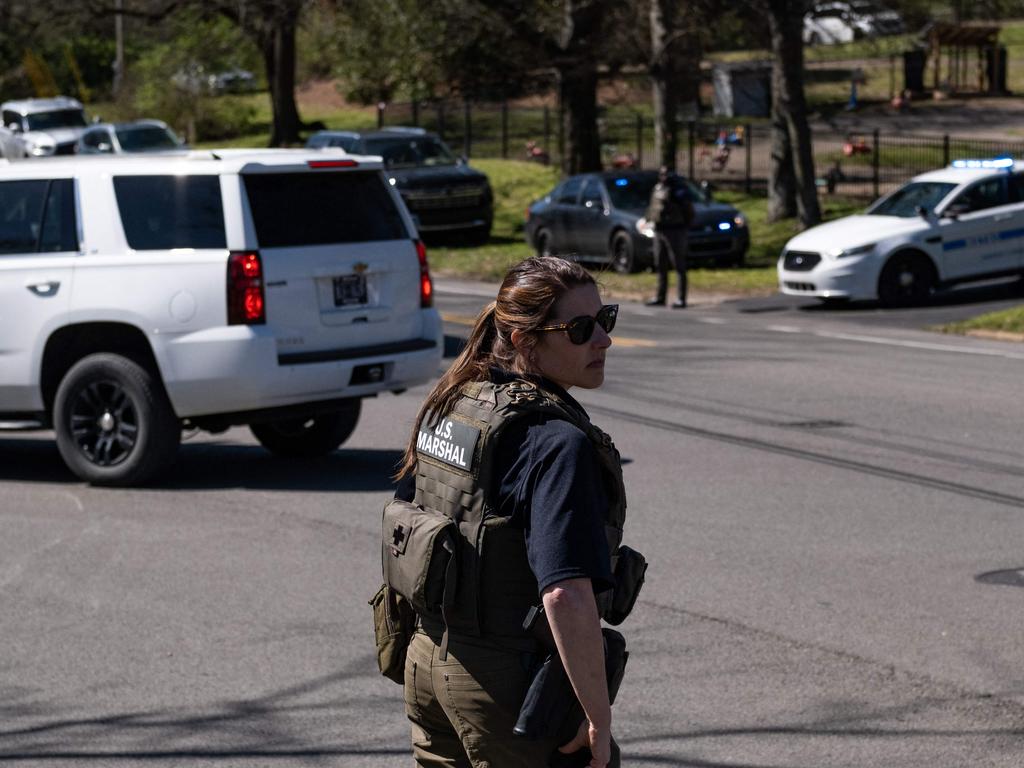 A US Marshal stands outside Woodmont Baptist Church while waiting for children to be reunited with their families after the mass shooting. Picture: Seth Herald/Getty Images