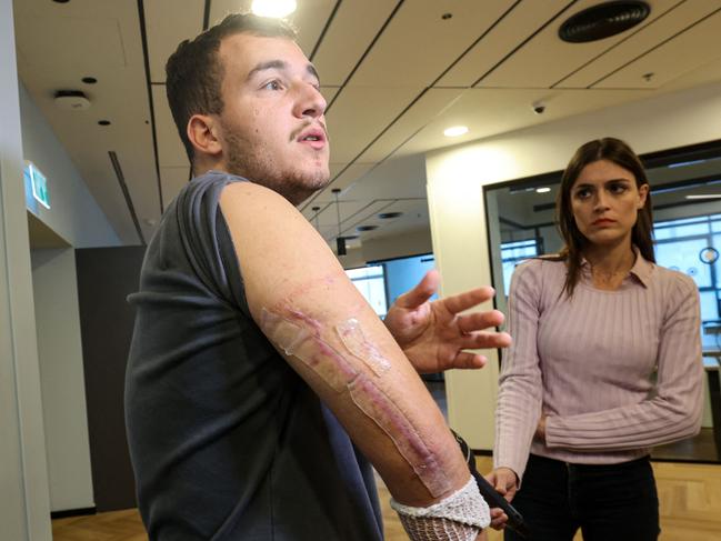 Israeli Tomer Tzadik receiving treatment after being shot in the arm by Hamas at the Supernova music festival. Hostages say they were drugged to stay docile in captivity. Picture: AFP