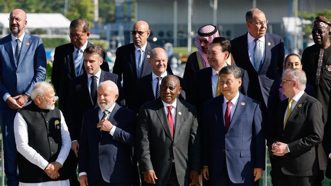 (L to R front) India's Prime Minister Narendra Modi speaks with Brazil's President Luiz Inacio Lula da Silva next to South Africa’s President Cyril Ramaphosa, China's President Xi Jinping and Anthony Albanese; (L to R middle) France's President Emmanuel Macron, Germany's Chancellor Olaf Scholz, South Korea's President Yoon Suk Yeol and Mexico's President Claudia Sheinbaum; (L to R back) the president of the European Council Charles Michel, Japan's Prime Minister Shigeru Ishiba, Mauritania's President and president of the African Union Mohamed Ould Ghazouani, Saudi Arabia's Foreign Minister Faisal bin Farhan Al Saud, Russia's Foreign Minister Sergey Lavrov, and Nigeria's President Bola Tinubu during the G20 family photo. Picture: AFP.