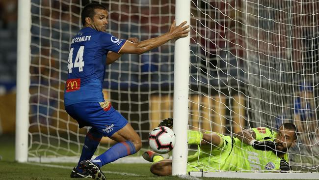 Paul Izzo made seven saves, including this one, in Adelaide United’s round-10 victory over Newcastle Jets. Picture: Ashley Feder/Getty Images