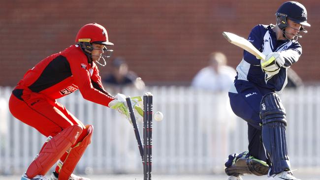 Victoria’s Mackenzie Harvey is bowled by Adam Zampa. Picture: AAP Image/Daniel Pockett