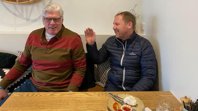 Gary Ayres and Andy Collins share a laugh over breakfast.