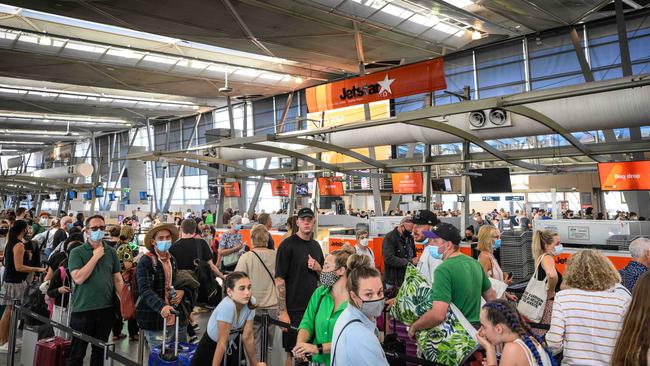 People queuing to check in for flights at Sydney Domestic Airport on Monday. Picture: NCA NewsWire / James Gourley