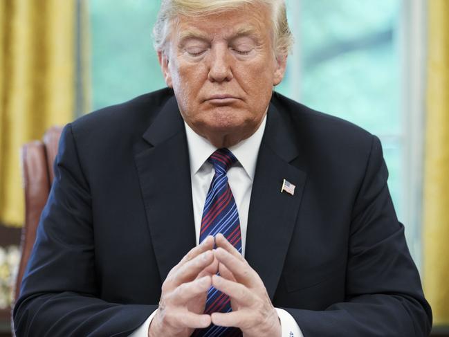 (FILES) In this file photo taken on August 27, 2018, US President Donald Trump listens during a phone conversation with Mexico's President Enrique Pena Nieto on trade, in the Oval Office of the White House in Washington, DC. - Firing the US election security chief and pressuring local officials to throw out valid votes, President Donald Trump and his Republicans are making desperate -- though likely futile -- attempts to invalidate Democrat Joe Biden's election win. Trump showed no sign on November 18, 2020 of letting up on his campaign to challenge results of the November 3 vote that only he and his staunchest supporters refuse to accept. Two weeks after Election Day -- with Biden's win recognized around the world, and his team hard at work preparing to assume office -- Trump appears convinced he can sow enough doubt to delay or even prevent the Democrat from being officially certified as the winner. (Photo by MANDEL NGAN / AFP)