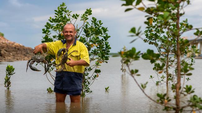 The big Wet has meant that crab fishos are excited for a bumper season of mud crab. Bradley Roe is looking forward to getting knee deep in the mud. Photograph: Che Chorley