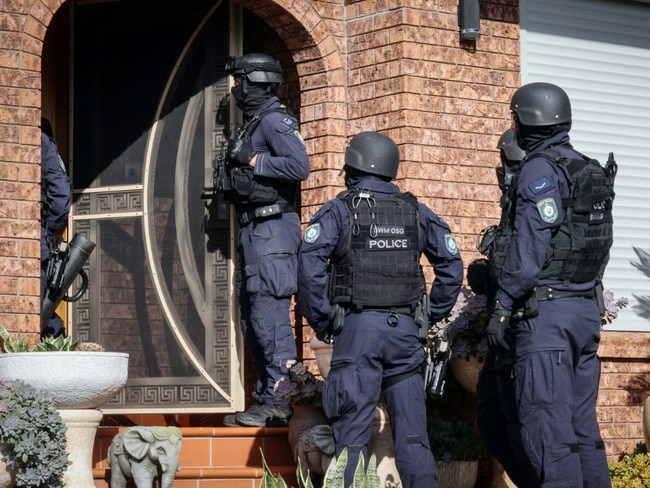 Officers conducting a search at a property of interest. Picture: NSW Police