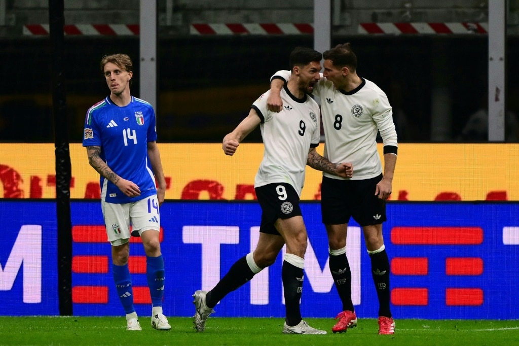 Germany goalscorers Tim Kleindienst and Leon Goretzka celebrate their side's equaliser against Italy