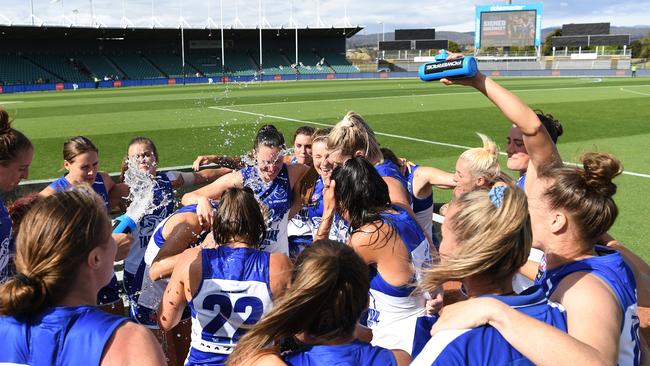 Kangaroos players celebrate the win during the Round 2 AFLW match between the North Melbourne Kangaroos and the GWS Giants at UTAS stadium. Picture: STEVE BELL/GETTY IMAGES