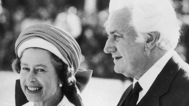 Sir John Kerr, then governor-general of Australia, escorts Queen Elizabeth II to her aircraft at Perth Airport, following her 1977 Jubilee Tour of the country. Picture: Getty Images