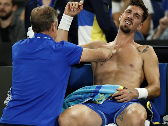 Thanasi Kokkinakis battled injury throughout his five-set loss to Jack Draper. Picture: Daniel Pockett/Getty Images