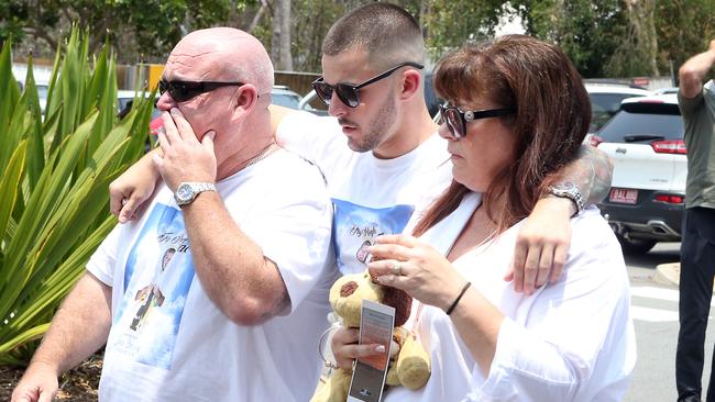 Jack Beasley's older brother Mitch with parents Brett and Belinda Beasley at the funeral. Picture: AAP Image/Richard Gosling