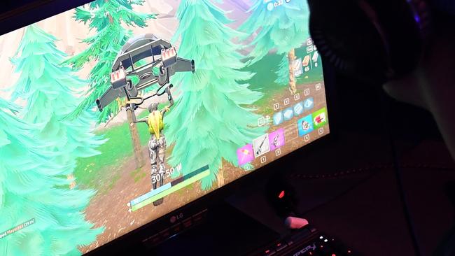 A gamer plays Fortnite against Twitch streamer and professional gamer Tyler ’Ninja’ Blevins during Ninja Vegas '18 at Esports Arena Las Vegas in 2018. Picture: AFP Photo / Getty Images North America / Ethan Miller