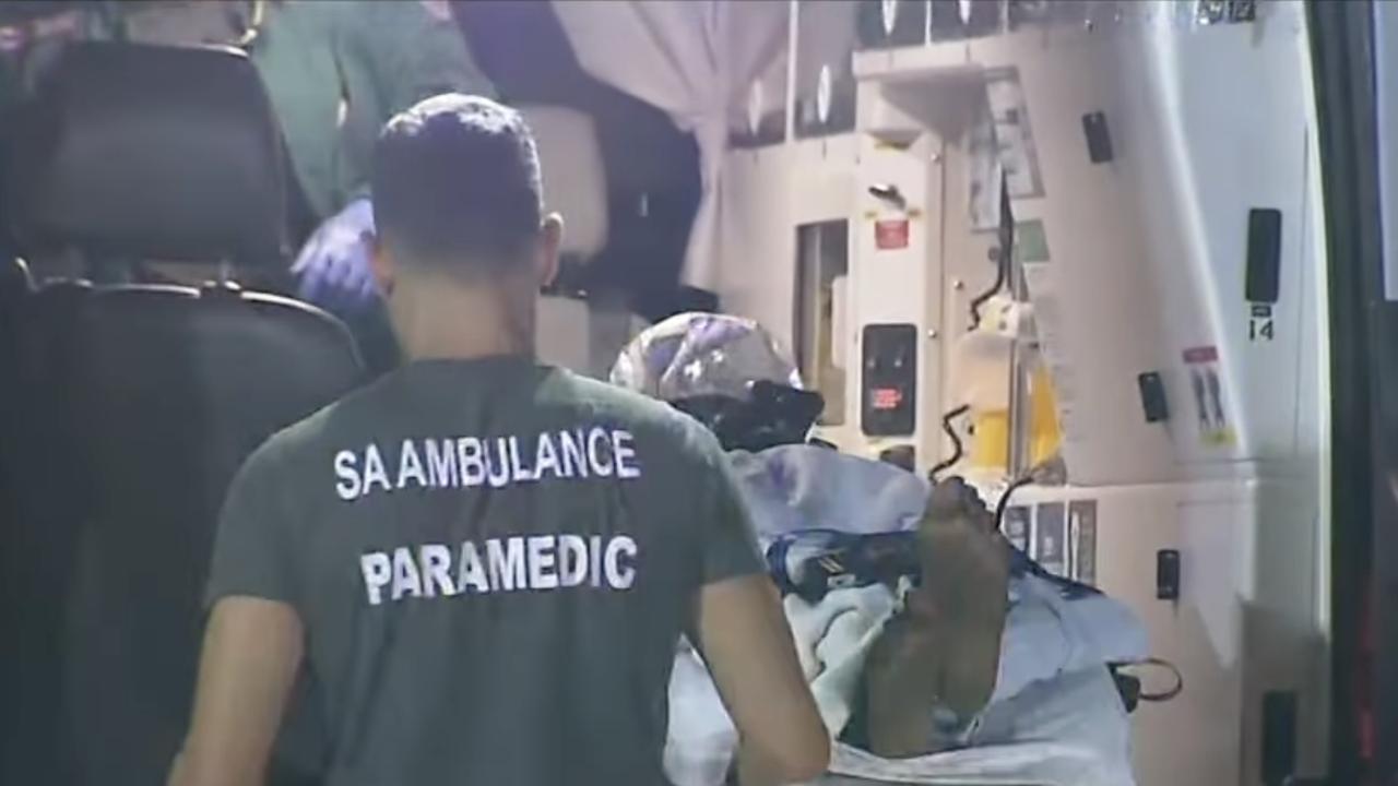 The victim is loaded into an ambulance after he was shot in the leg inside his Kilburn home. Picture: 7NEWS