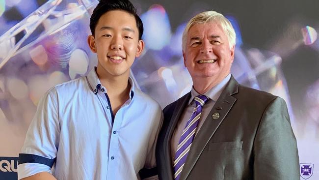 Somerset College graduate Kevin Song was awarded a distinguished academic achievement award at the QCAA awards over the weekend, with Headmaster Craig Bassingthwaighte.