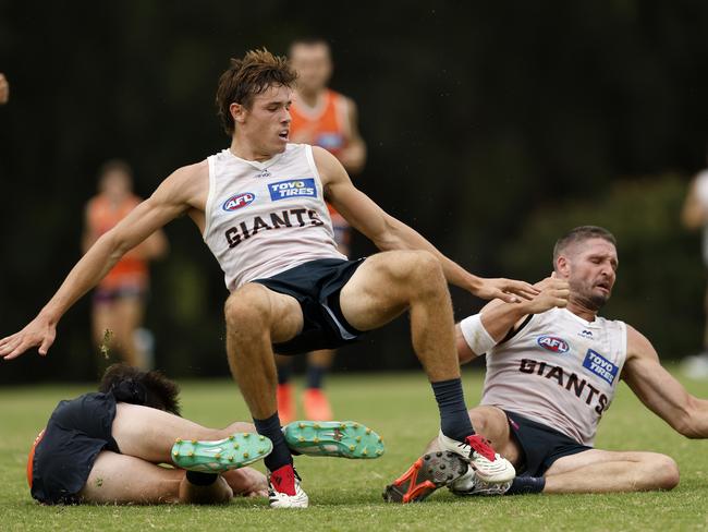 Taylor was left on the ground after what appeared to be a heavy knock in a marking contest. Picture: Phil Hillyard