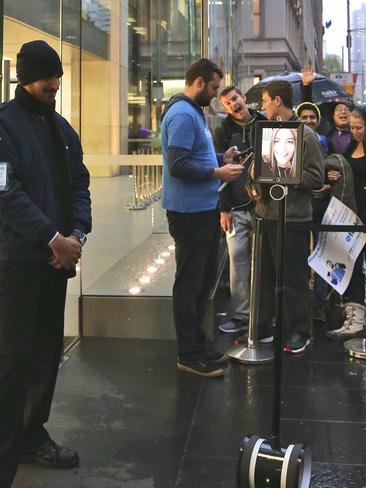 Lucy Kelly has prime position in the Apple line thanks to her Atomic 212 robot, controlled remotely. AP Photo/Glenn Nicholls