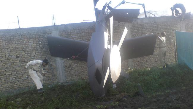 Part of a damaged helicopter lying near the compound after U.S. Navy SEAL commandos killed al Qaeda leader Osama bin Laden. Picture: REUTERS/Stringer