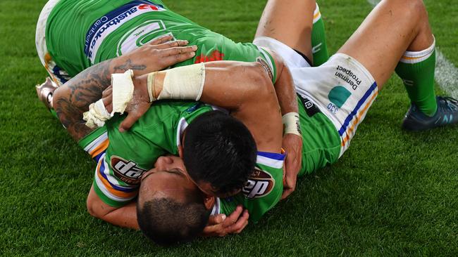 Joseph Leilua and Jordan Rapana embrace after their loss. Picture: AAP Image/Dean Lewins