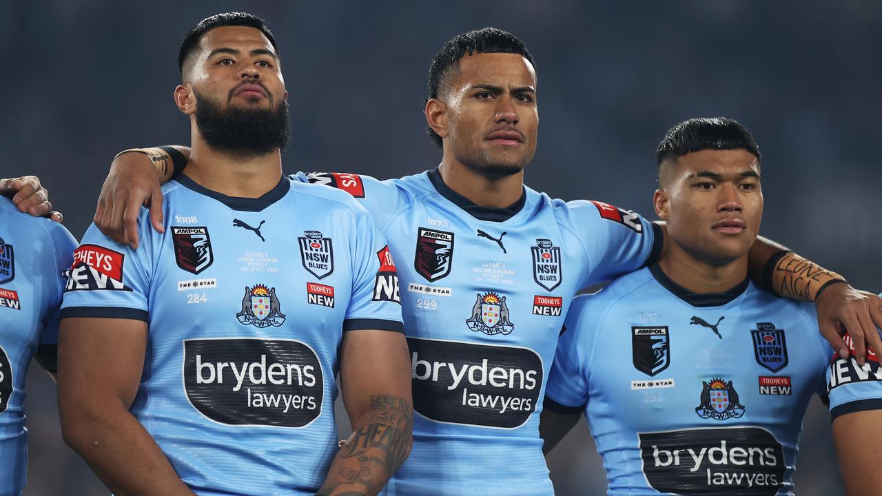 SYDNEY, AUSTRALIA - JUNE 08: (L-R) Payne Haas, Stephen Crichton and Brian ToÃ¢â&#130;¬â&#132;¢o of the Blues line up for the national anthem during game one of the 2022 State of Origin series between the New South Wales Blues and the Queensland Maroons at Accor Stadium on June 08, 2022, in Sydney, Australia. (Photo by Mark Kolbe/Getty Images)