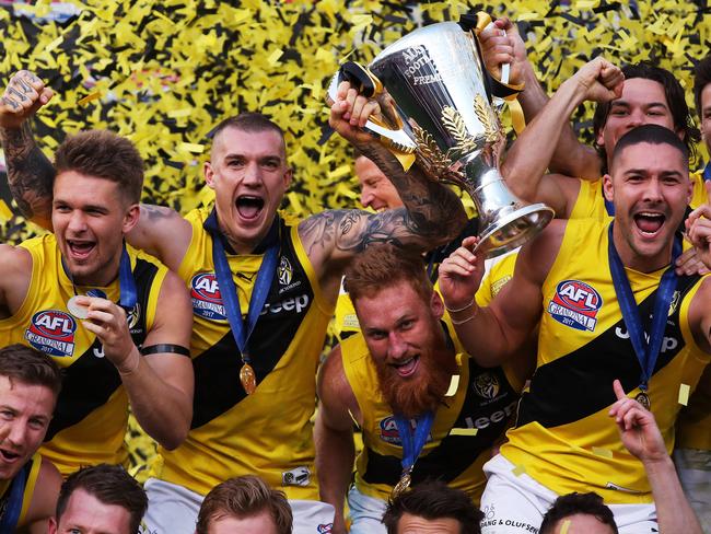 The Tiger's Dustin Martin celebrates with the Premiership Cup after Richmond defeated the Adelaide Crows in the 2017 AFL Grand Final at the MCG. picture. Phil Hillyard