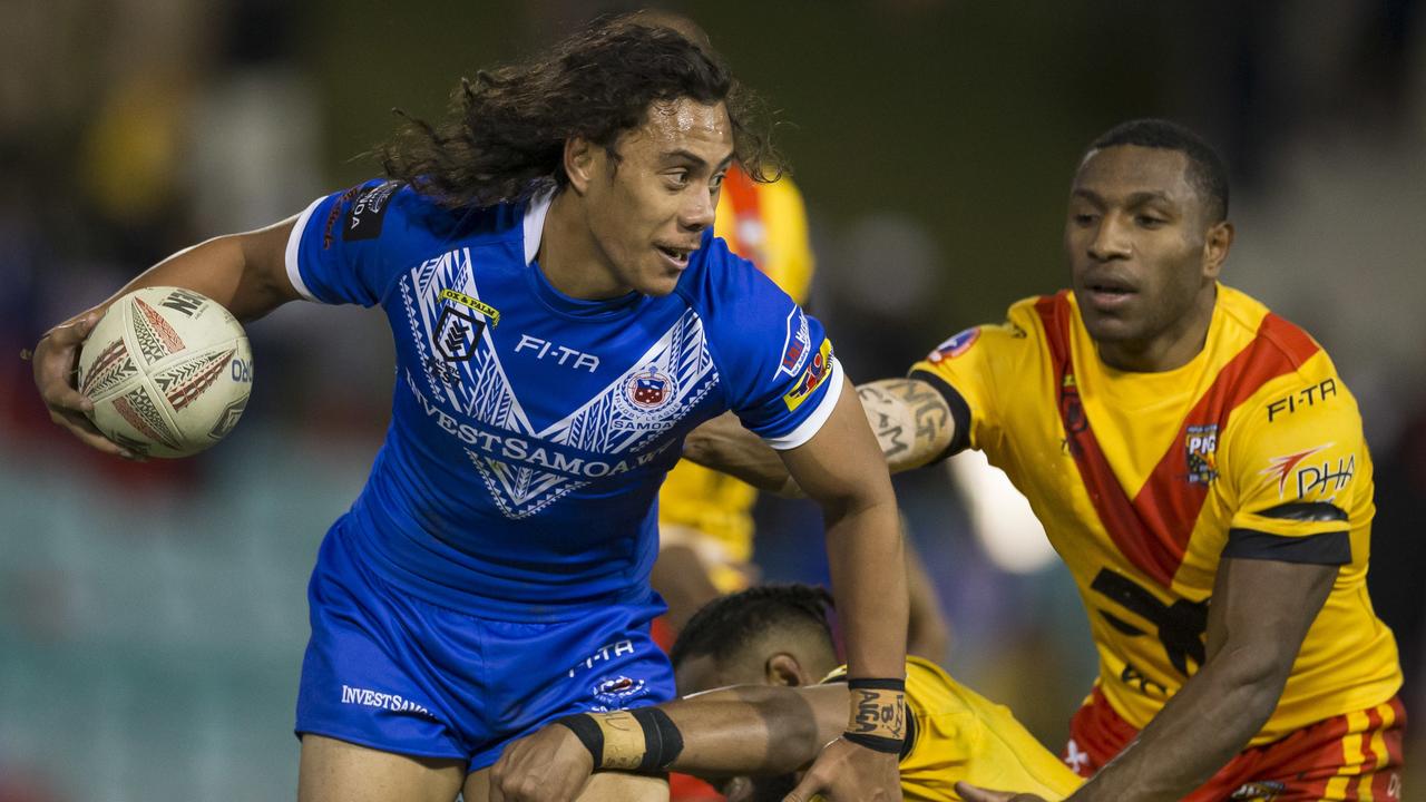 Jarome Luai of Samoa is tackled during the Pacific Test