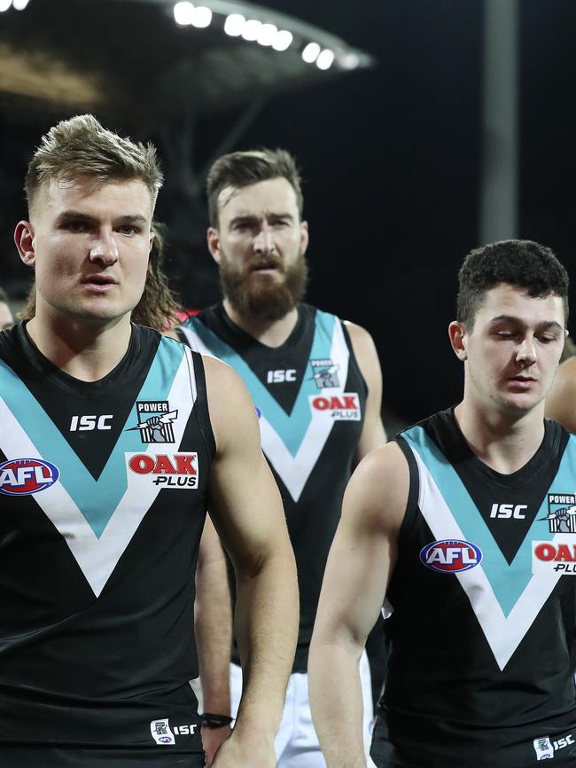 Ollie Wines, Charlie Dixon and Darcy Byrne-Jones after the Showdown loss. Picture SARAH REED