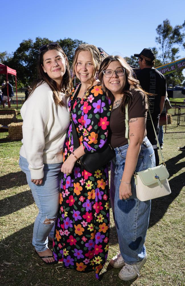 At Sadie's Day Out are (from left) Adrianna Thompson, Bri Groves and Tiana Hamilton. The event, a special celebration of the life of five-year-old crash victim Sadie, was held at Cambooya State School, Saturday, June 7, 2025. Picture: Kevin Farmer