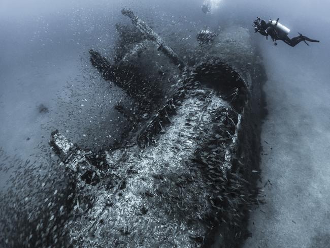 Highly commended category 3... Wrecks. Capturing history. An underwater photographer lines up a shot of the conning tower of the wreck of the U-352 off the coast of North Carolina, USA. During WWII, German U-boats patrolled the waters just off the east coast of the U.S. In May 1942 the U-352 fired upon the USCGC Icarus but missed. The Icarus retaliated, and sunk the U-352 in 120ft of water 26 miles southeast of Beaufort Inlet. During this particular dive the visibility was especially good, so my goal was to capture wide angle images with as much of the wreck in the frame as I could get. As I was lining up the shot, a fellow photographer was focusing on the conning tower, so I decided to include him in the image to give a sense of scale to the wreck. Picture: Tanya Houppermans/USA/UPY 2017