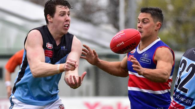 Aberfeldie's Daniel Thompson fires off a handball on Saturday. Picture: Jamie Morey