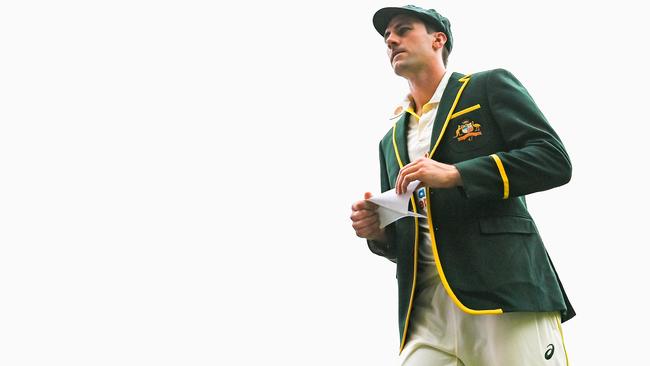 Australian captain Pat Cummins leaves the field following the toss during day one of the First Test Match in the Ashes series between Australia and England at The Gabba on December 08, 2021 in Brisbane, Australia. (Photo by Bradley Kanaris/Getty Images)