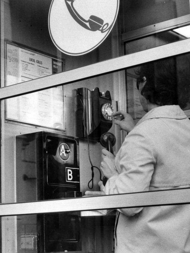 A woman uses a phone box in Melbourne in 1967.