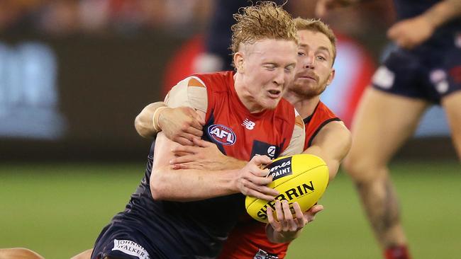 Clayton Oliver is brought down in a tackle from Devon Smith. Picture: Getty Images