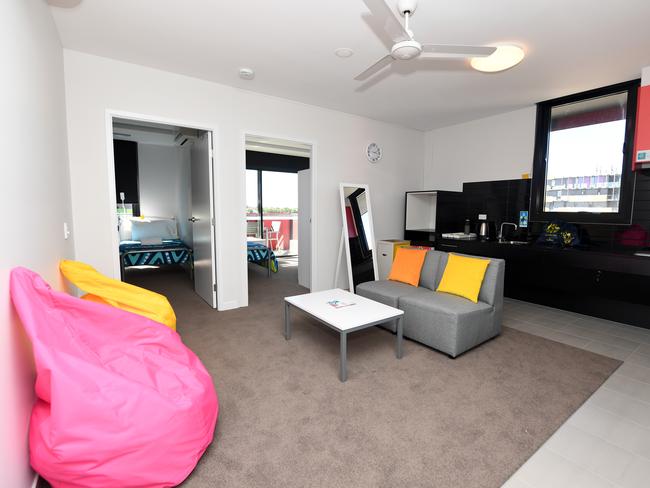 The living room and kitchen area of athletes accomodation is seen during a media tour