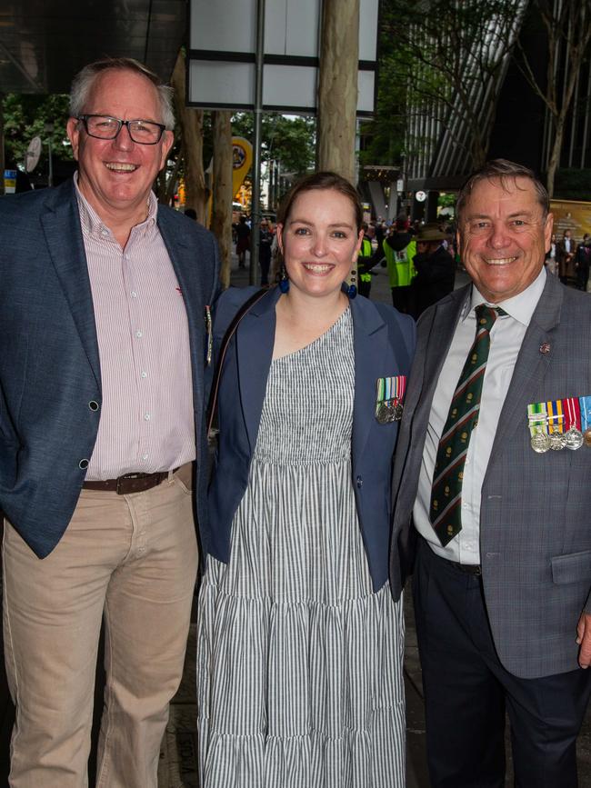 Thousands of people have braved the rain to gather in Brisbane for Anzac Day services. Picture: Grace Kessels