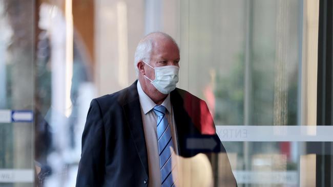 Retired officer Damian Loone arrives at the Supreme Court to give evidence. Picture: Damian Shaw