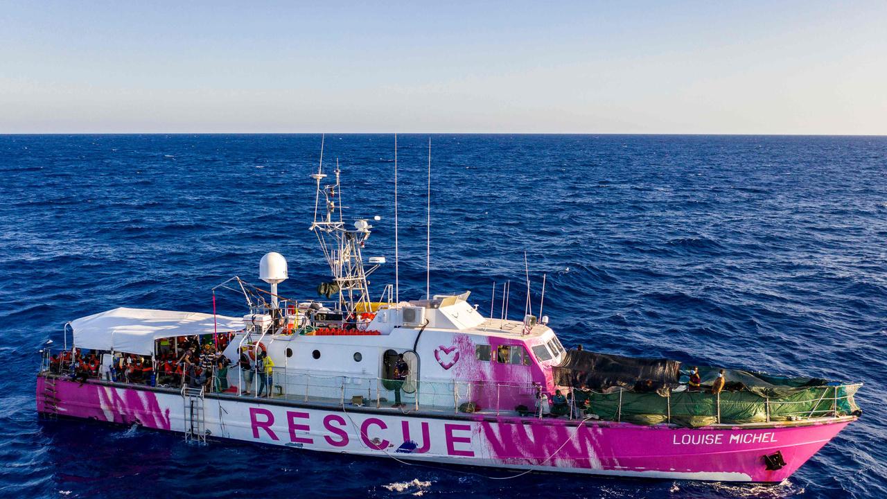 The rescue ship <i>Louise Michel</i> can be seen with a pink paint job from infamous street artist Banksy. Picture: Thomas Lohnes / AFP