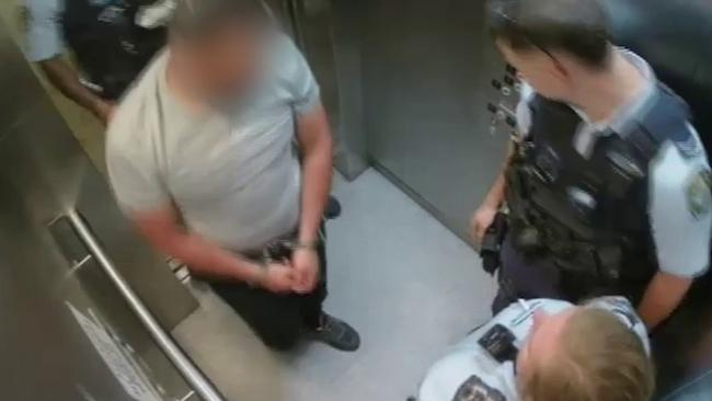 Police with one of the alleged offenders after the arrest. Picture: NSW Police