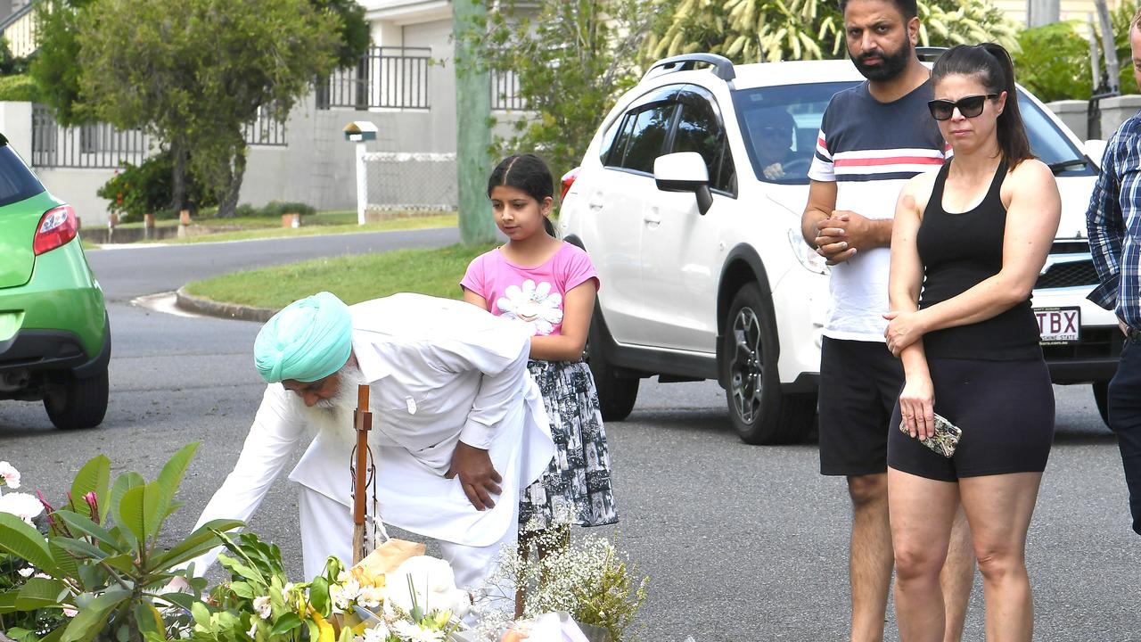 People drop off flowers at the street where Hannah and her children were attacked. Picture: John Gass/AAP