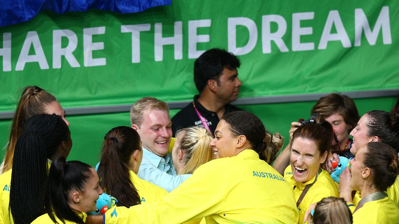 Teammates congratulate Nicole Seekamp after she got engaged after the Opals won gold. Picture: Getty