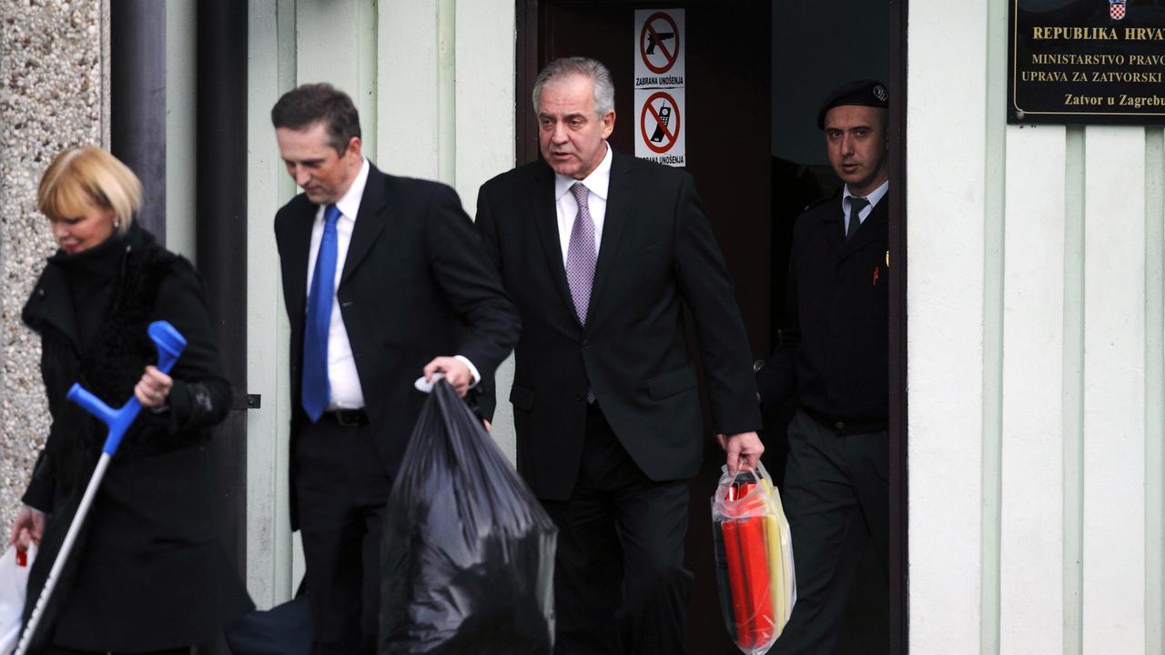 Croatia's former Prime Minister Ivo Sanader (C) accompanied with his lawyers leaving a prison in Zagreb.