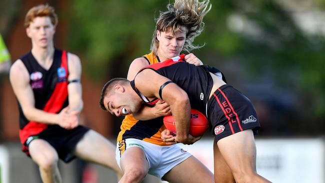 Matthew Stillman of Pascoe Vale is tackled. (Photo by Josh Chadwick)