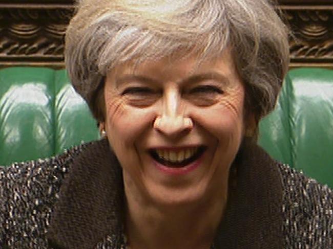 In a still image taken from video footage broadcast by the UK Parliamentary Recording Unit on January 25, 2017 British Prime Minister Theresa May (C) smiles during an exchange during the weekly Prime Minister's Questions session in the House of Commons in central London on January 25, 2017. / AFP PHOTO / PRU / - / RESTRICTED TO EDITORIAL USE - MANDATORY CREDIT " AFP PHOTO / PRU " - NO MARKETING NO ADVERTISING CAMPAIGNS - NO RESALE - NO DISTRIBUTION TO THIRD PARTIES - 24 HOURS USE - NO ARCHIVES