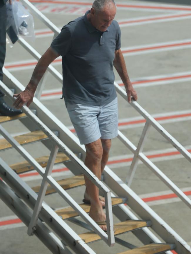 Chris Dawson steps off the plane after landing in Sydney. Picture: John Grainger