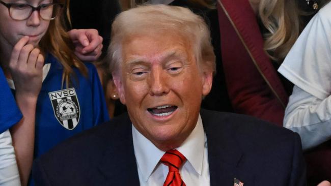 US President Donald Trump speaks as he signs the No Men in Women's Sports Executive Order into law in the East Room of the White House in Washington, DC, on February 5, 2025. President Trump on Wednesday is signing an executive order to ban transgender girls and women from competing on sports teams that match their gender identity, marking his latest move targeting transgender rights. (Photo by ANDREW CABALLERO-REYNOLDS / AFP)