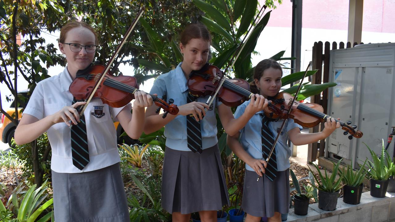 Maryborough State High School Students (L) Lilith Felgendrejeris, Olivia Maxwell and Molly Field played their violins for International Women's Day at The Maryborough Neighbourhood Centre.