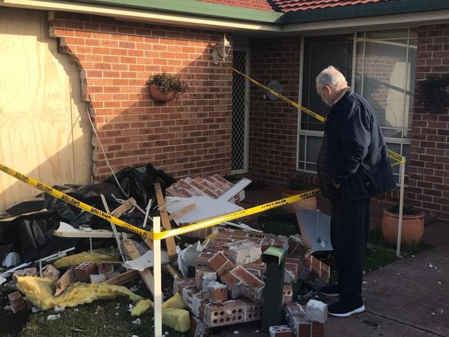 John Tynan looks at the damaged bedroom. Picture: Seven News