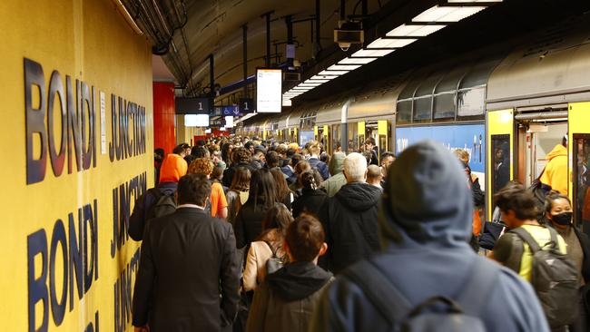 Commuters pile onto a train at Bondi Junction train station on Wednesday afternoon. Train drivers went on strike between 10am and 4pm causing a disruption to the regular time tables. Picture: Richard Dobson