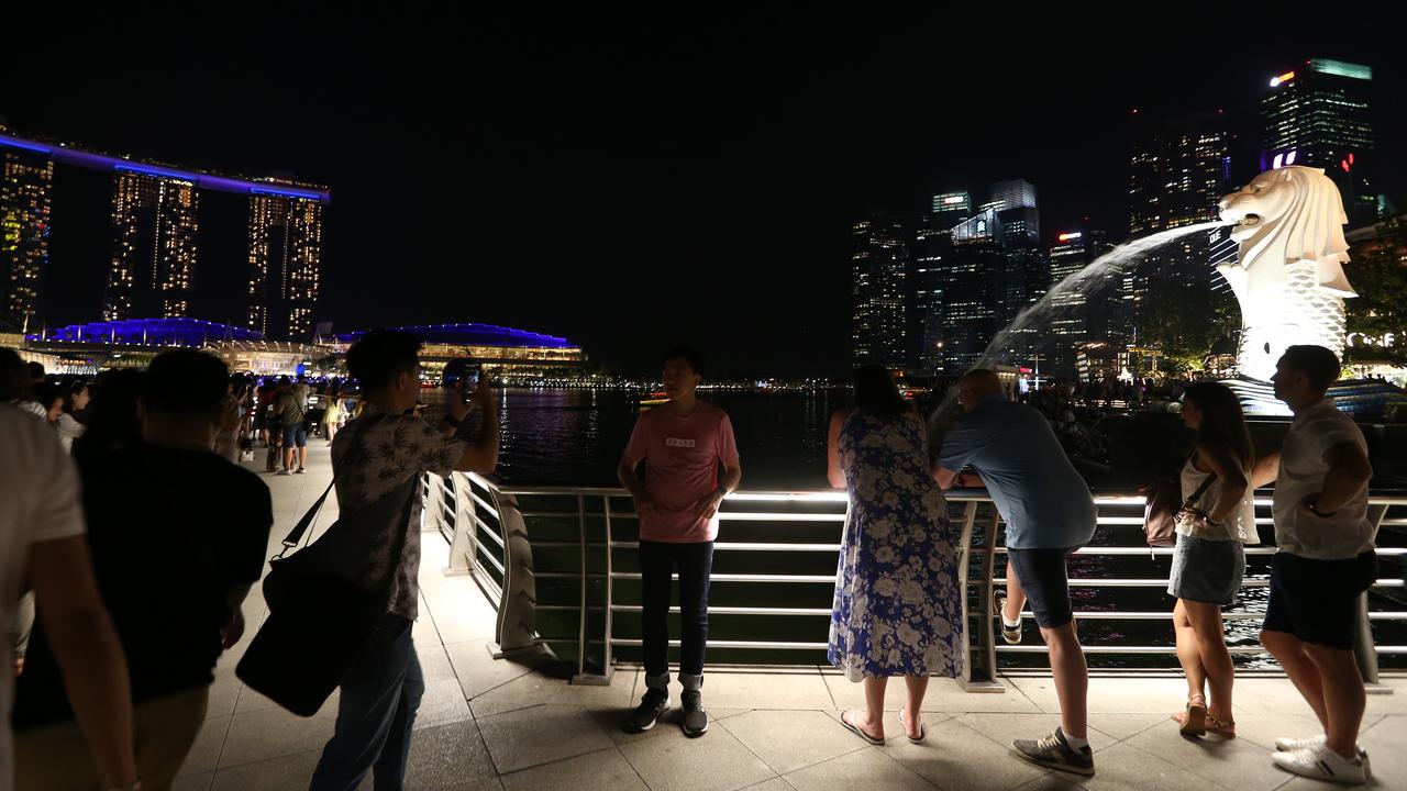 Tourists take in the amazing views on Singapore’s harbour. Picture: Vanessa Hunter