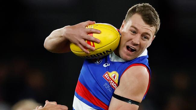 MELBOURNE, AUSTRALIA - AUGUST 20: Jack Macrae of the Bulldogs is tackled by Liam Duggan of the Eagles during the 2023 AFL Round 23 match between the Western Bulldogs and the West Coast Eagles at Marvel Stadium on August 20, 2023 in Melbourne, Australia. (Photo by Michael Willson/AFL Photos via Getty Images)